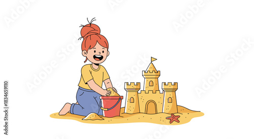 Happy little girl with a top knot bun playing in the sand and building a detailed sandcastle on the beach during summer vacation.