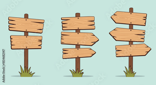 Three rustic wooden signposts with blank planks and arrow shapes, standing in grass against a light blue background.