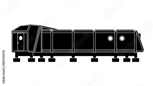 Silhouette of a long, industrial train car or modular building structure on stilts