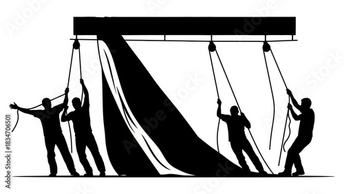 Team of people pulling a large black fabric with ropes and pulleys to reveal something