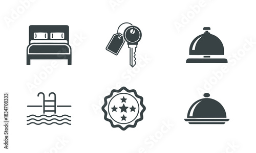 Set of six dark gray hotel and hospitality icons including a bed, key, service bell, pool, rating badge, and food cloche isolated on