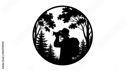 Silhouette of a photographer with a backpack taking a picture in a forest setting, surrounded by trees and foliage.