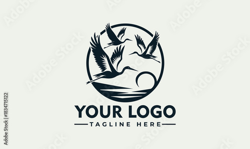 Elegant flying cranes vector logo illustration representing nature and freedom, classic EPS style