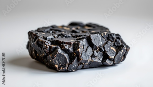 A collection of irregularly shaped brown glass objects that appear to be crafted with an artistic flair.