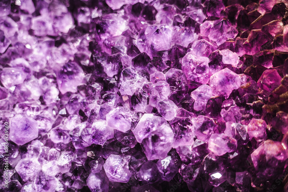 Naklejka premium Dense amethyst crystal cluster with vivid purple tones and sharp geometric formations