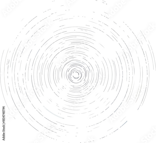 Concentric circular streaks of varying gray density radiate from a central point