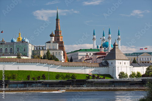 Kazan Kremlin, the city of Kazan, Republic of Tatarstan, Russia. Summer view of the Kazan Kremlin from the Kazanka River. The Syuyumbike Tower rises above the white fortress wall. Tourist attraction.