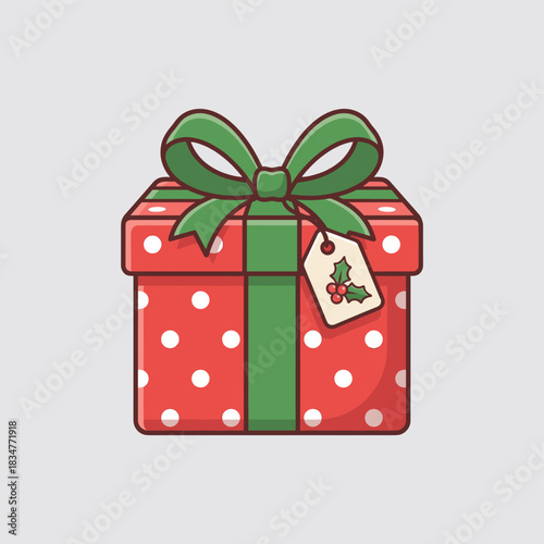 A red gift box with white polka dots, green ribbon, and a holly tag for holiday decoration.