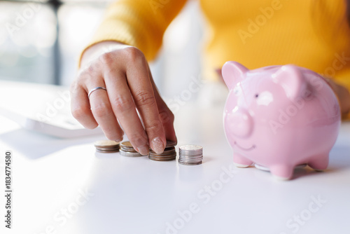 Asian woman hand making stack of coin. invest save finance concept, saving money, investment
