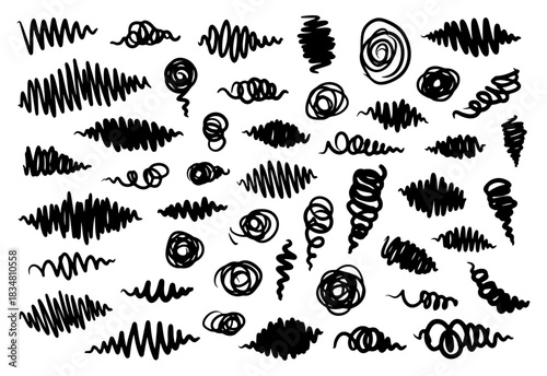 Set of chaotic hand-drawn black scribbles, a collection of messy abstract doodles, swirls, and zigzag lines, vector design elements