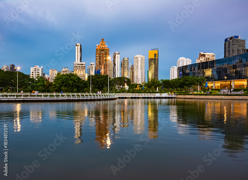 View of Ratchada Lake at cloudy afternoon in Benchakitti Park. Bangkok cityscape at Benjakitti Park.