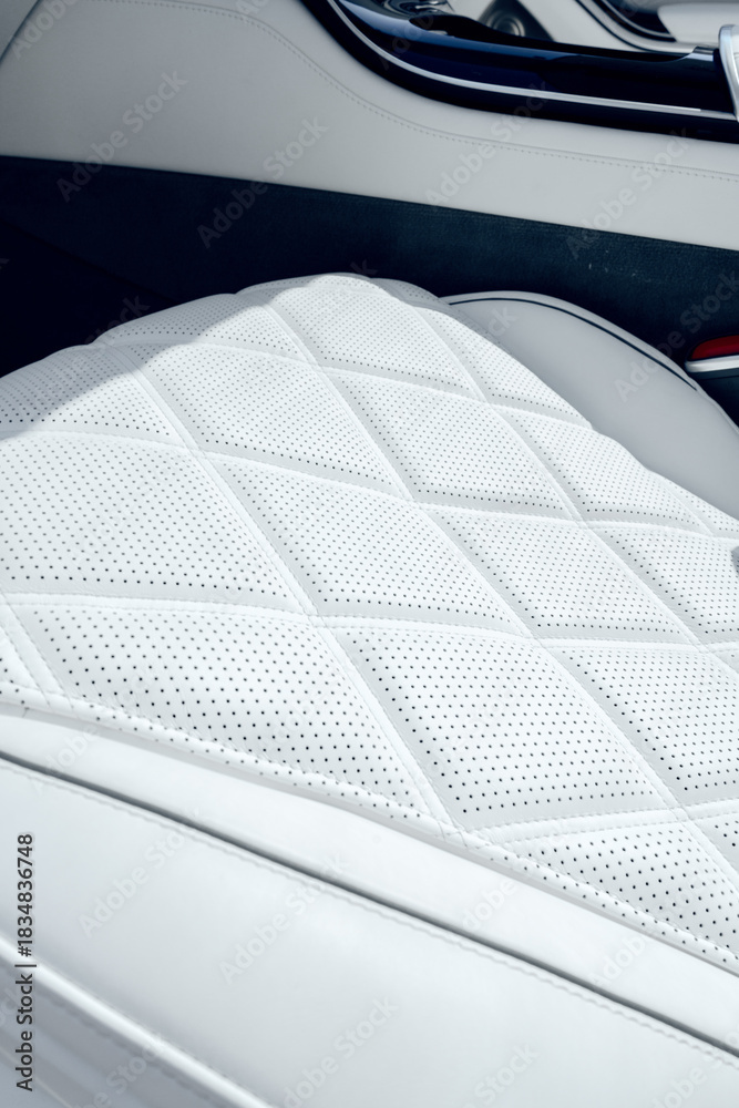Naklejka premium Modern car interior with detailed white leather seat design and perforations on display