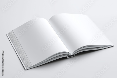 High angle view of an open hardcover book with blank white pages for copy space.