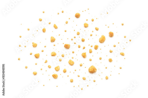 Flying cookie crumbs dispersing on transparent background. Broken biscuit pieces creating an explosion effect, sweet snack texture