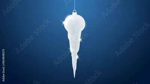 A shimmering translucent icicle ornament with sparkling highlights hangs suspended against a deep blue background evoking winter and holiday cheer