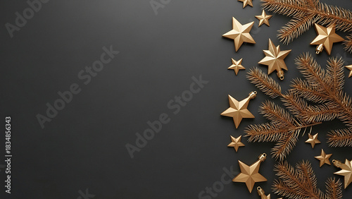 Golden christmas stars and pine branches on a dark background creating a festive holiday scene