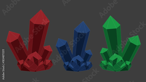 Set of three vibrant, faceted gemstones in red, blue, and green, isolated on a neutral background
