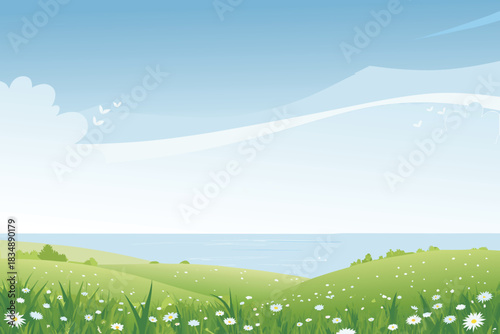 A peaceful landscape showing green hills a blue sea and a clear