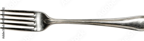 Close-up view of a metal fork on a white surface, tines clearly visible. Silverware cutlery