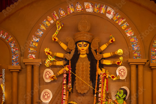 Photos A beautifully crafted handmade colorful goddess durga idol decorated for Navratri, featuring vibrant traditional attire, intricate jewellery, and divine expressions at colorful pandal