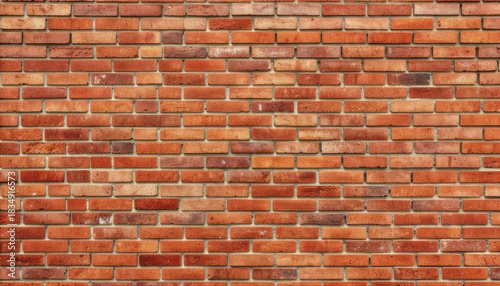 Rustic red brick wall with natural imperfections creating an organic and earthy background.