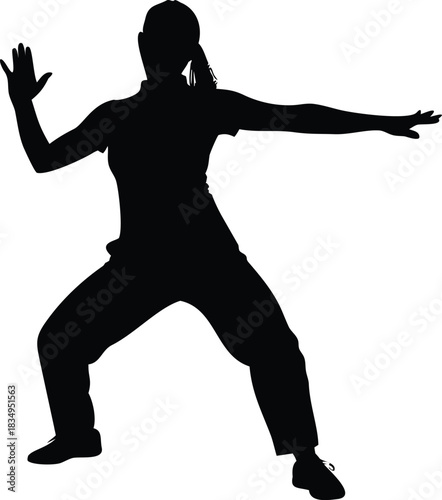 a silhouette of a woman practicing tai chi or martial arts pose