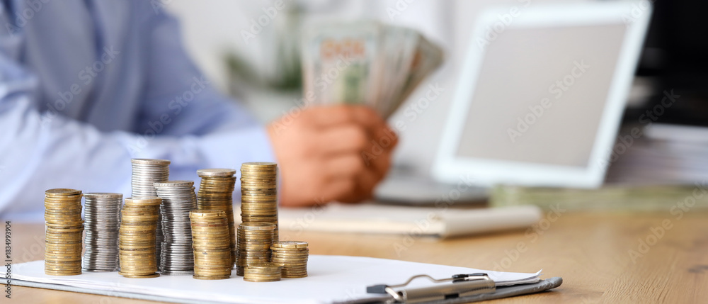 Fototapeta premium Money on table of businessman in office