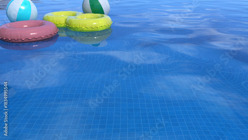 Summer time, image of swimming pool with swim ring and swim ball floating on clear pool water that reflected bright clear sky above.