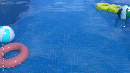 Summer time, image of swimming pool with swim ring and swim ball floating on clear pool water that reflected bright clear sky above.