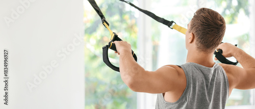 Sporty young man training w...