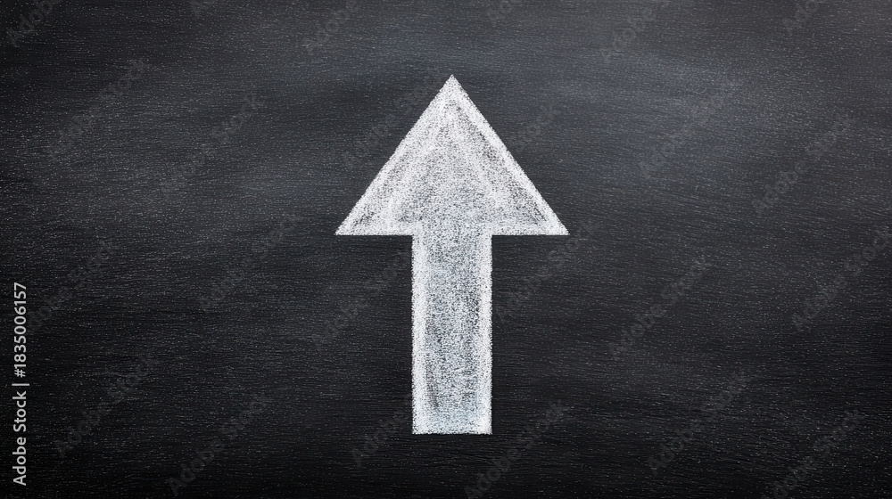 Fototapeta premium Teacher growth mindset arrow pointing upward drawn with chalk on blackboard inspiring progress and learning