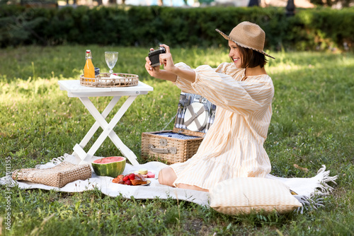 Young woman taking pictures...