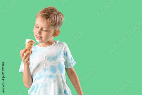 Little boy with ice-cream a...