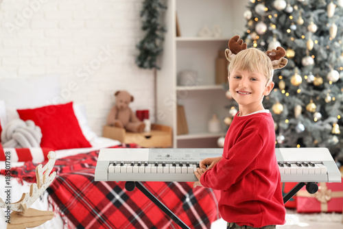 Cute little boy in reindeer...