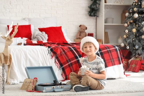 Cute little boy in Santa ha...