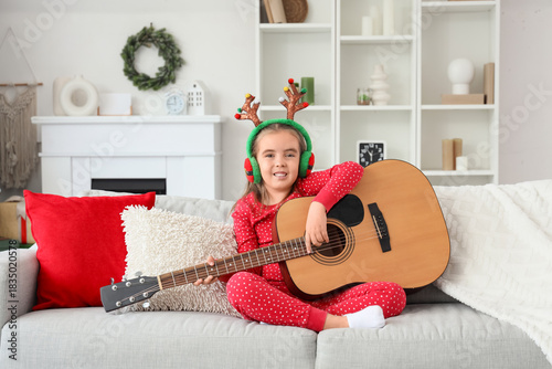 Cute little girl in reindee...