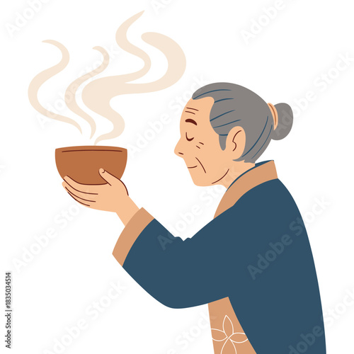 Elderly East Asian woman holding a warm cup of tea