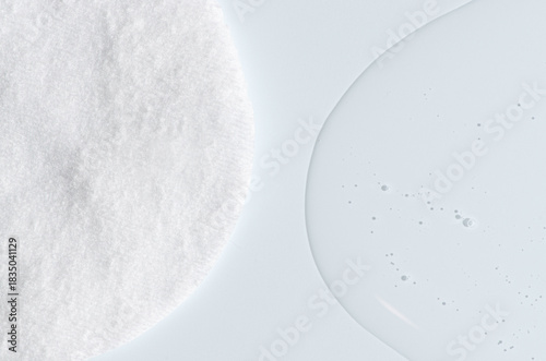 A cotton pad for removing makeup and micellar water.