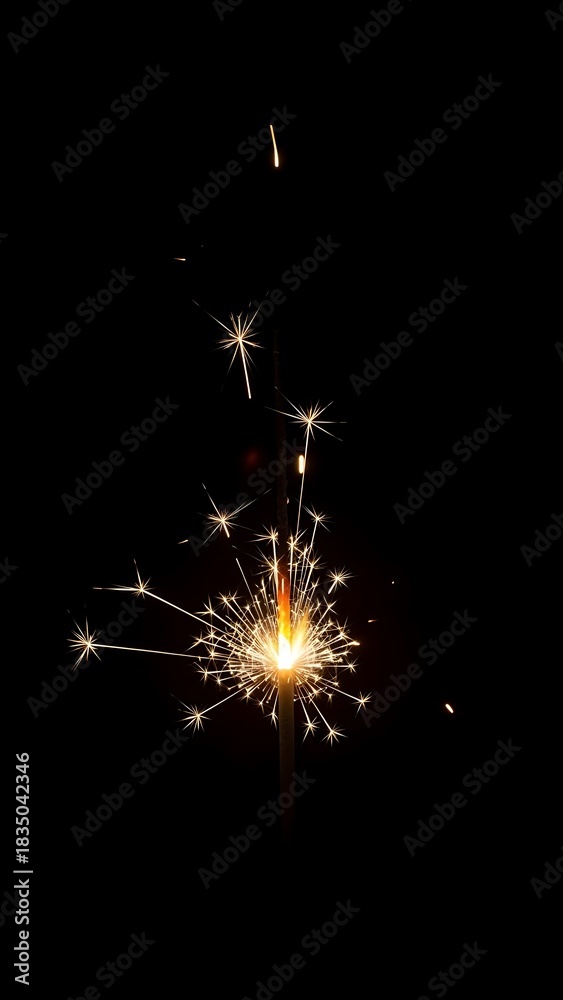 Obraz premium Sparkler glowing in the dark a festive light perfect for celebrations and special events