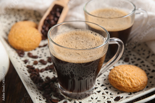 Glass cups of hot coffee wi...