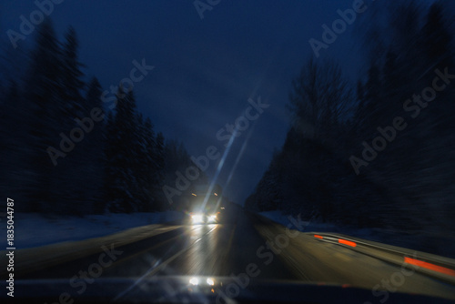 Windshield Glare With Passing Headlights Streaks And Interior Reflections, Smeared Glass And Icy Smears