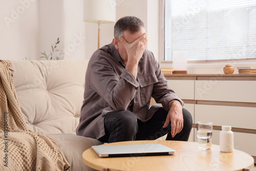 Mature man feeling unwell o...