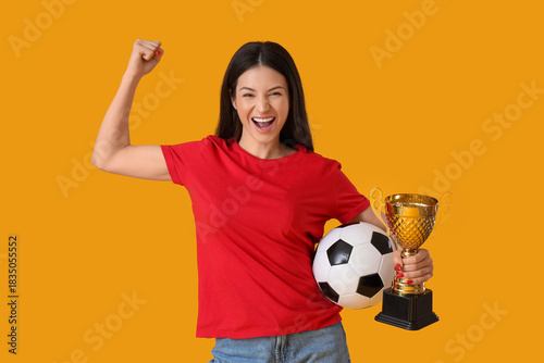 Happy young woman with socc...