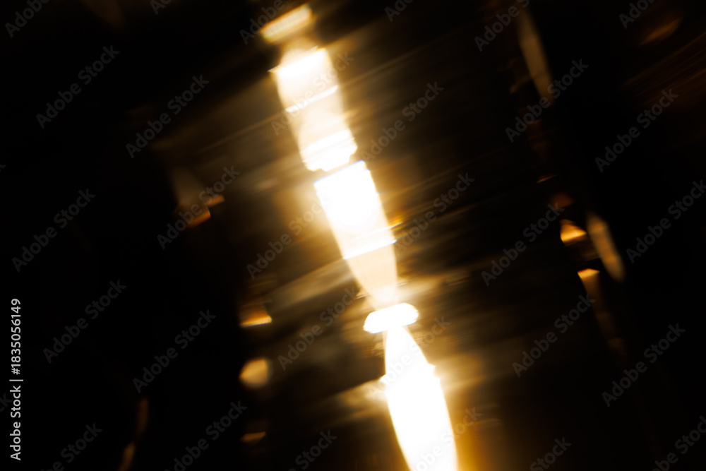 Fototapeta premium Lens Flare. Light over black background. Easy to add overlay or screen filter over photos. Abstract sun burst with digital lens flare background. Gleams rounded and hexagonal shapes.