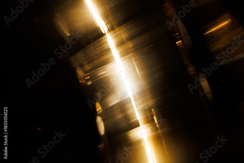 Lens Flare. Light over black background. Easy to add overlay or screen filter over photos. Abstract sun burst with digital lens flare background. Gleams rounded and hexagonal shapes.