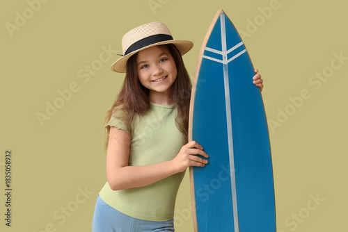Cute girl with surfboard on...