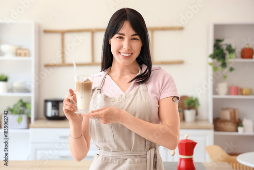 Smiling young woman with gl...
