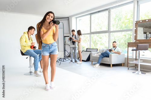 Smiling female photographer...