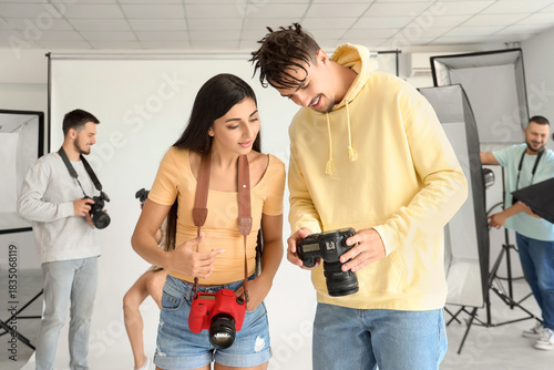 Young photographers looking...