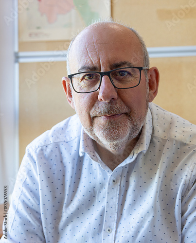 Successful mature businessman looking directly at the camera with a neutral expression